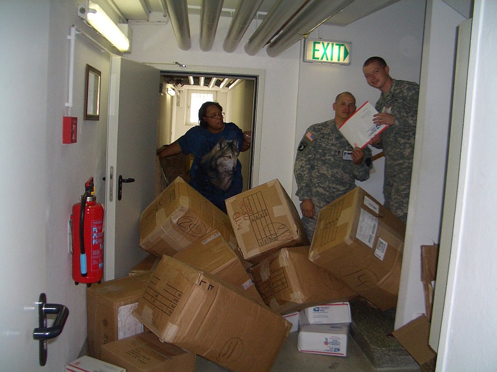 Mail Call at Landstuhl with boxes of donated items for Soldiers' Angels